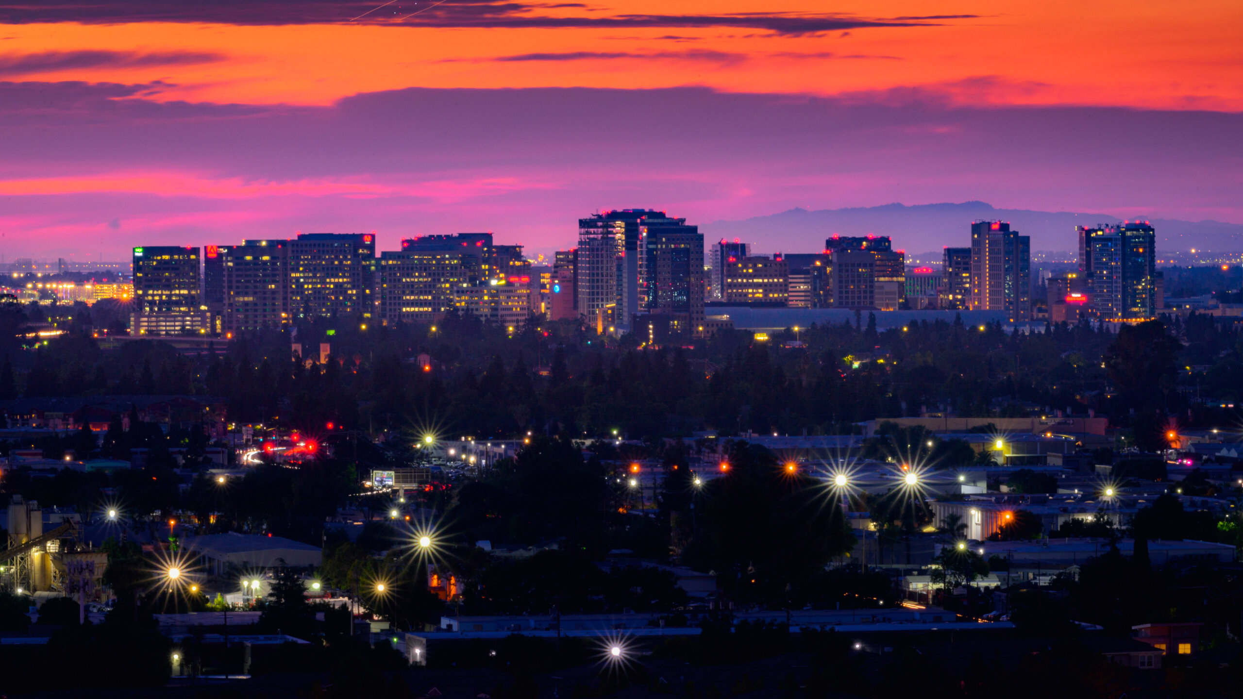 san jose night view of downtown cityscape with colorful sunset