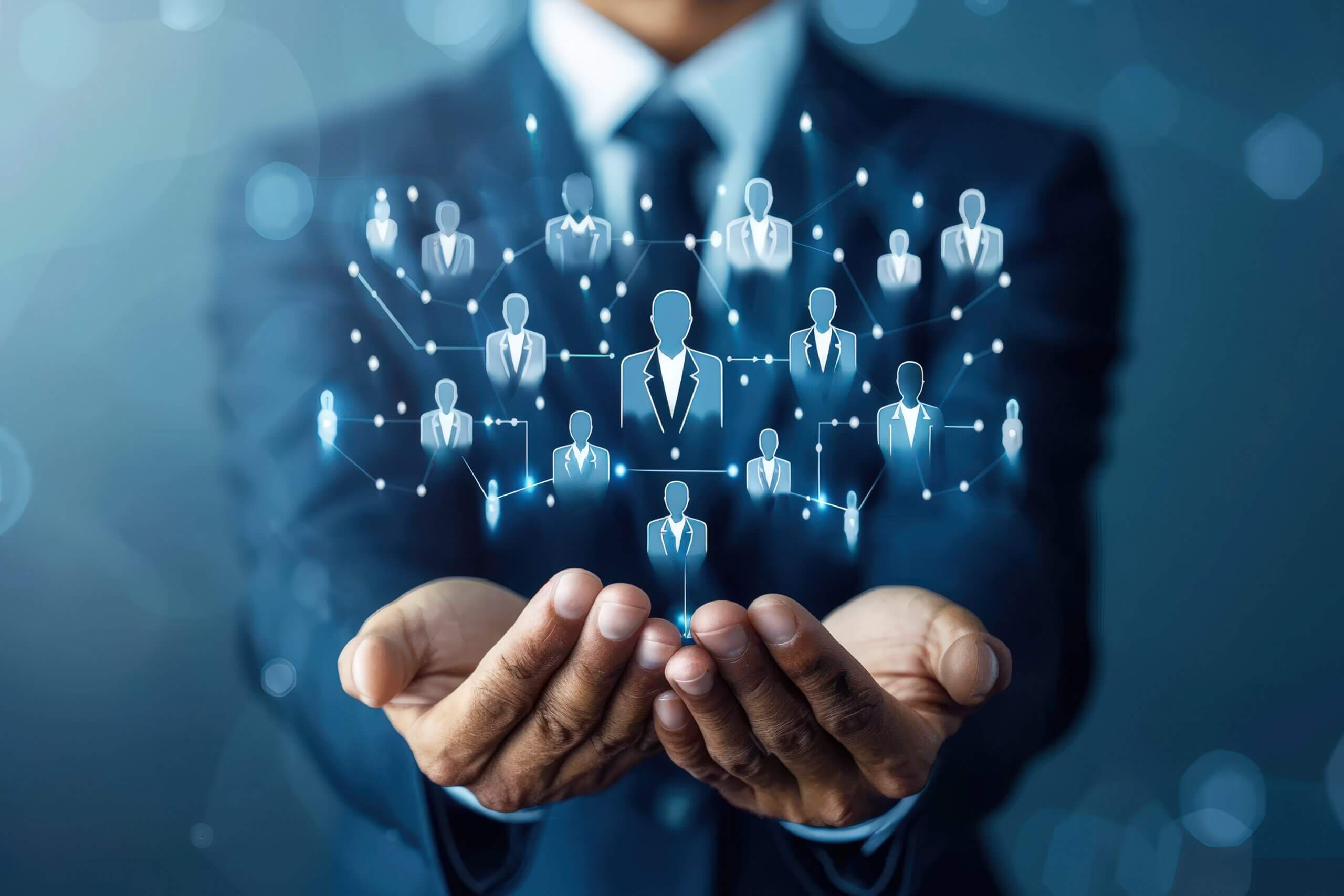 Businessperson holding a glowing digital network of professional connections.