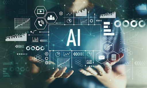 A person holds their hands open in front of a digital interface with the large text "AI" at the center. Surrounding it are futuristic icons and data graphics, including charts, gears, and hexagons, representing artificial intelligence and technology.