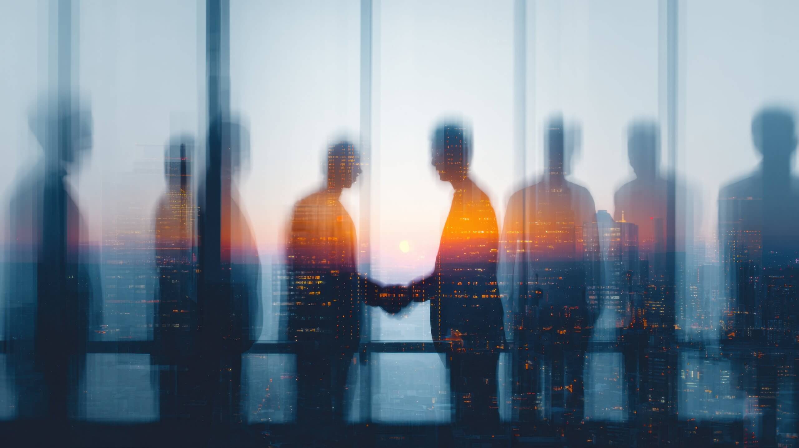 Blurred silhouettes of business leaders shaking hands against a city skyline, symbolizing collaboration, governance, and trust in the AI era.