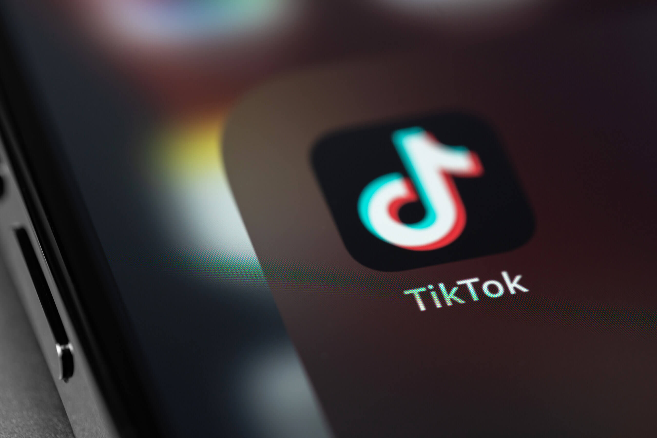 TikTok icon mobile app on screen smartphone iPhone closeup. TikTok is app to create and share videos.
