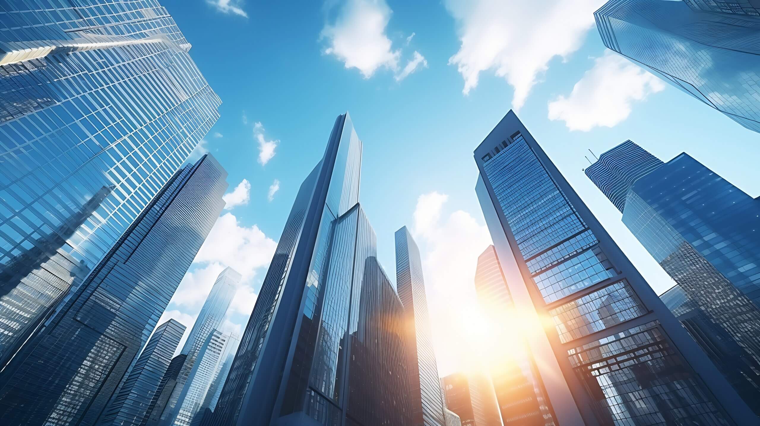 business and financial skyscraper buildings concept.Low angle view and lens flare of skyscrapers modern office building city in business center with blue sky.