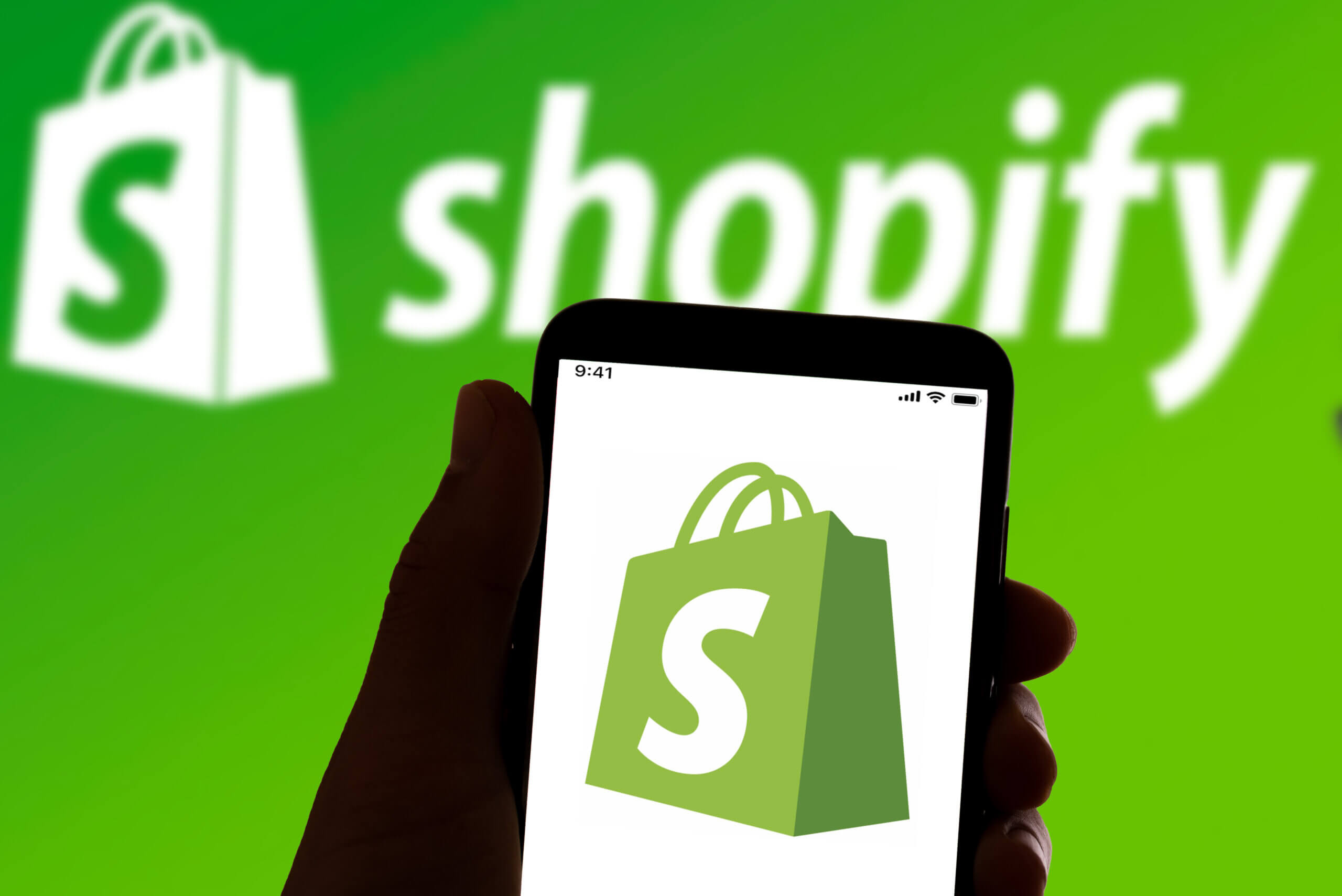 The online payment and banking app Shopify logo is seen on the screen of a mobile phone in Barcelona, Spain on July 06, 2022