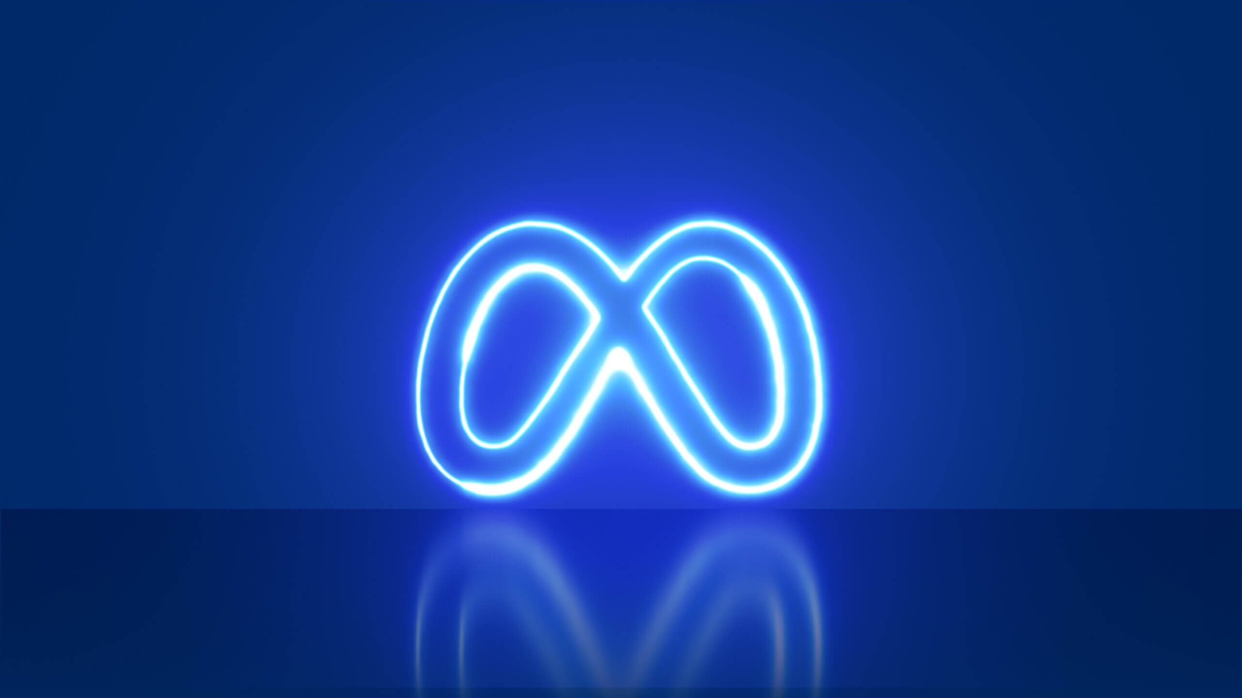 Meta logo neon on blue background. Rebrand of Facebook, Instagram Whatsapp Messenger, integration. Neon light.