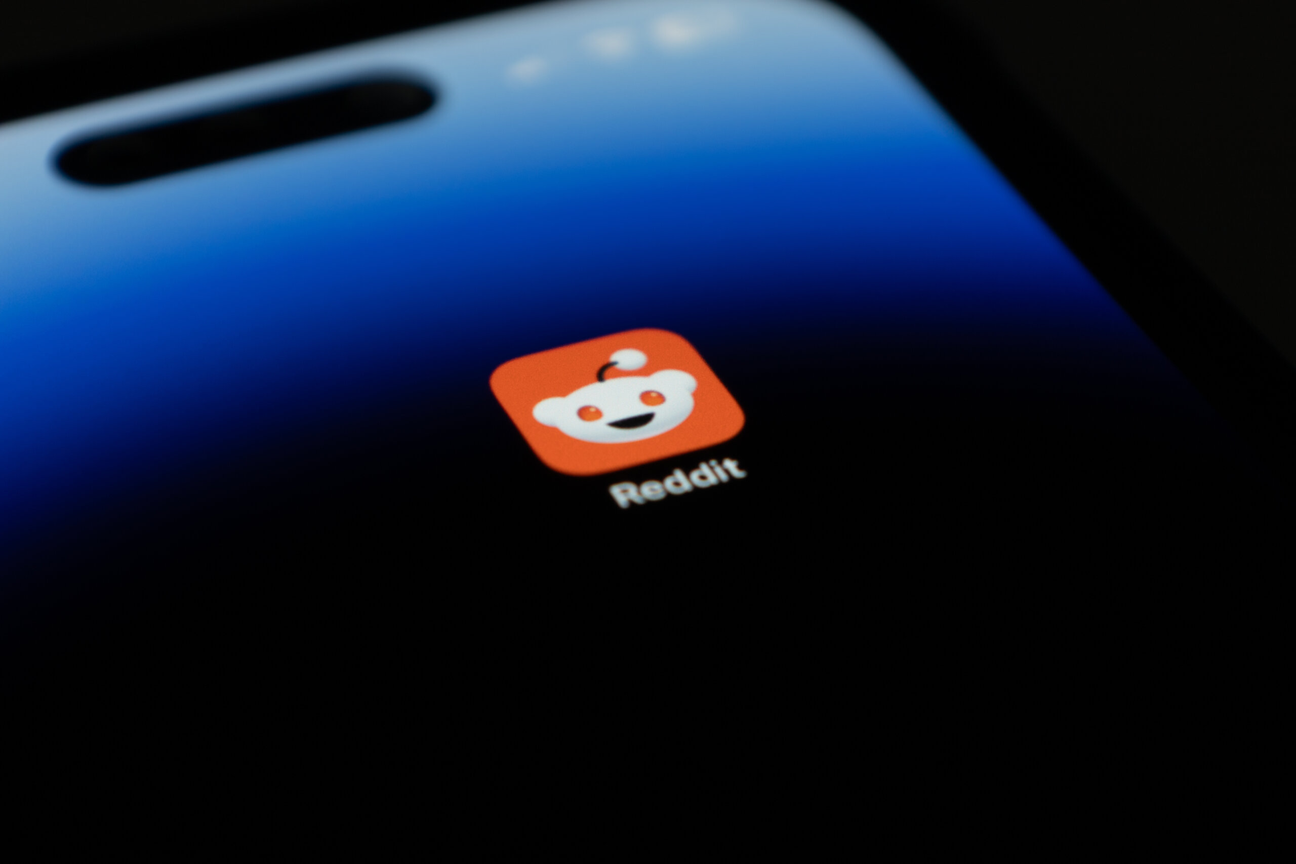 Closeup Reddit app on iPhone 14 Pro home screen